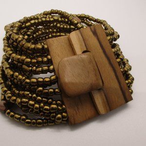STRETCH GOLD SEED BEAD BRACELET WITH UNIQUE WOODEN BUCKLE CLOSURE